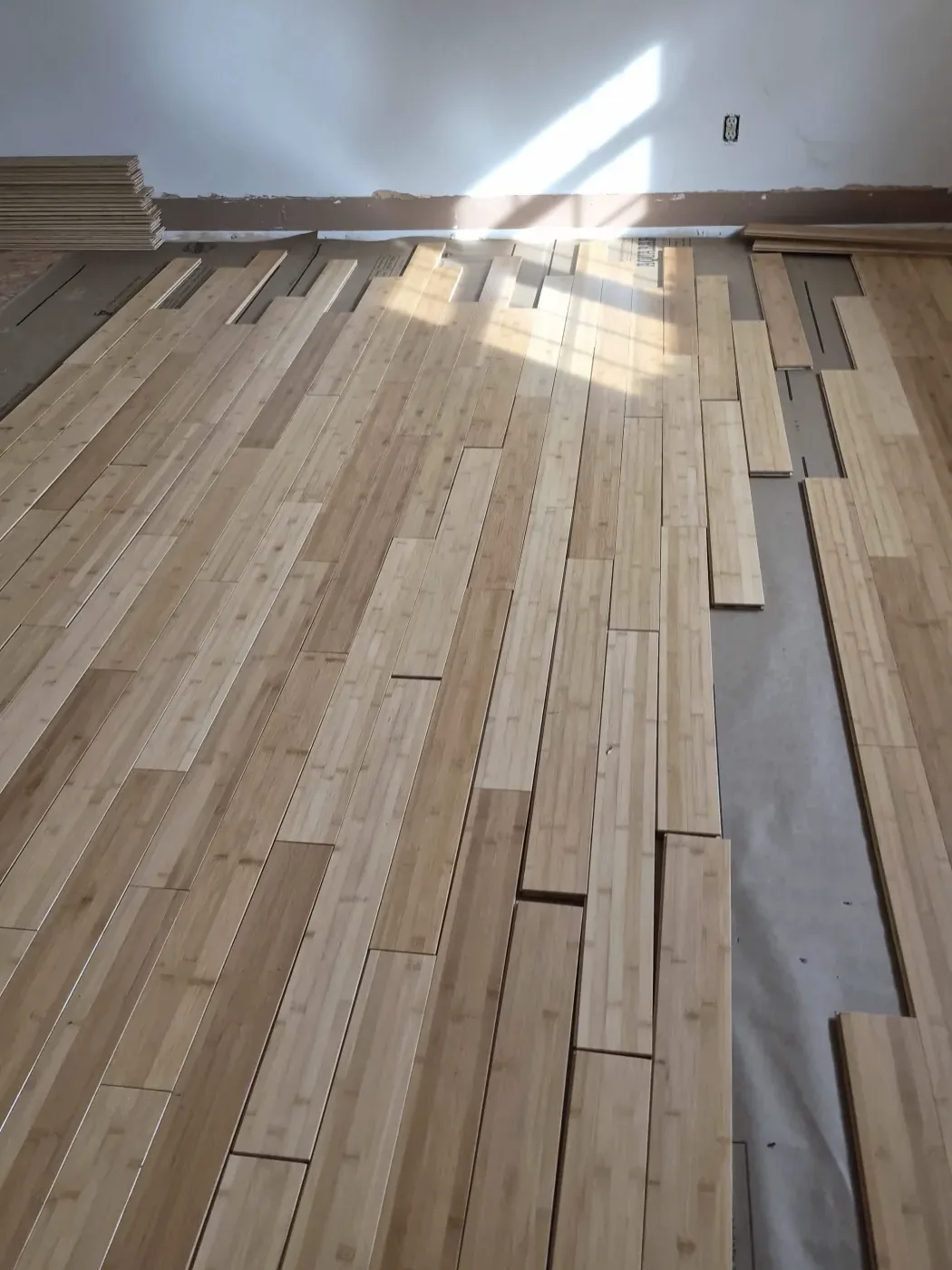 Wood floor boards laid out during an installation