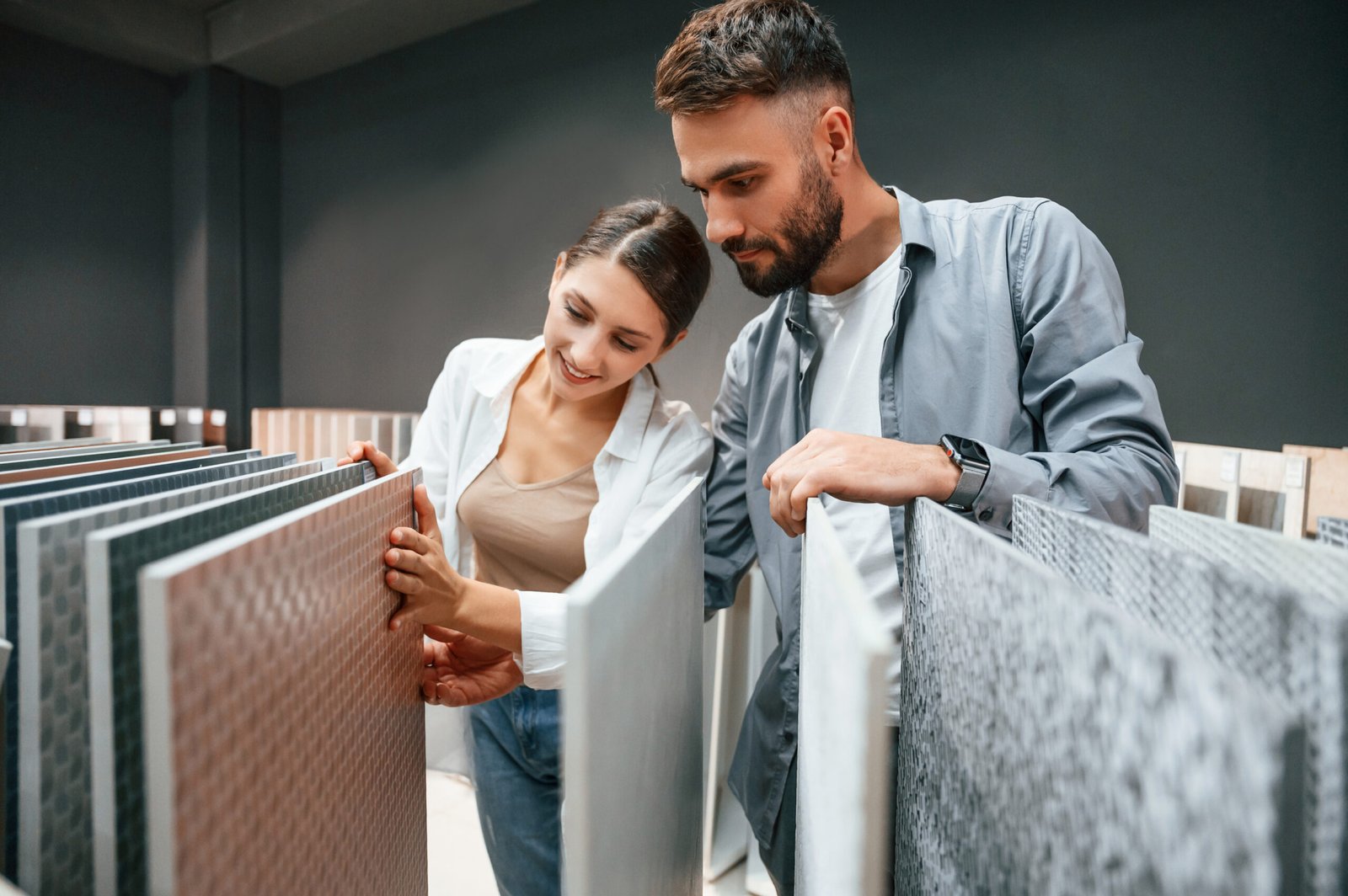 Looking for products. Woman and man is in the store of goods for the home.